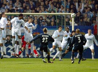David Beckham scores a free-kick for Real Madrid against Marseille in the Champions League in 2003.