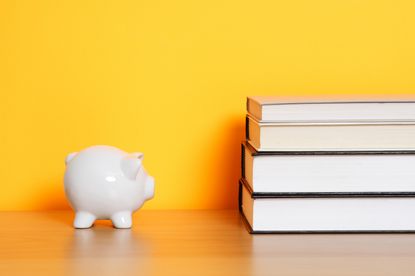 Piggy bank and books.