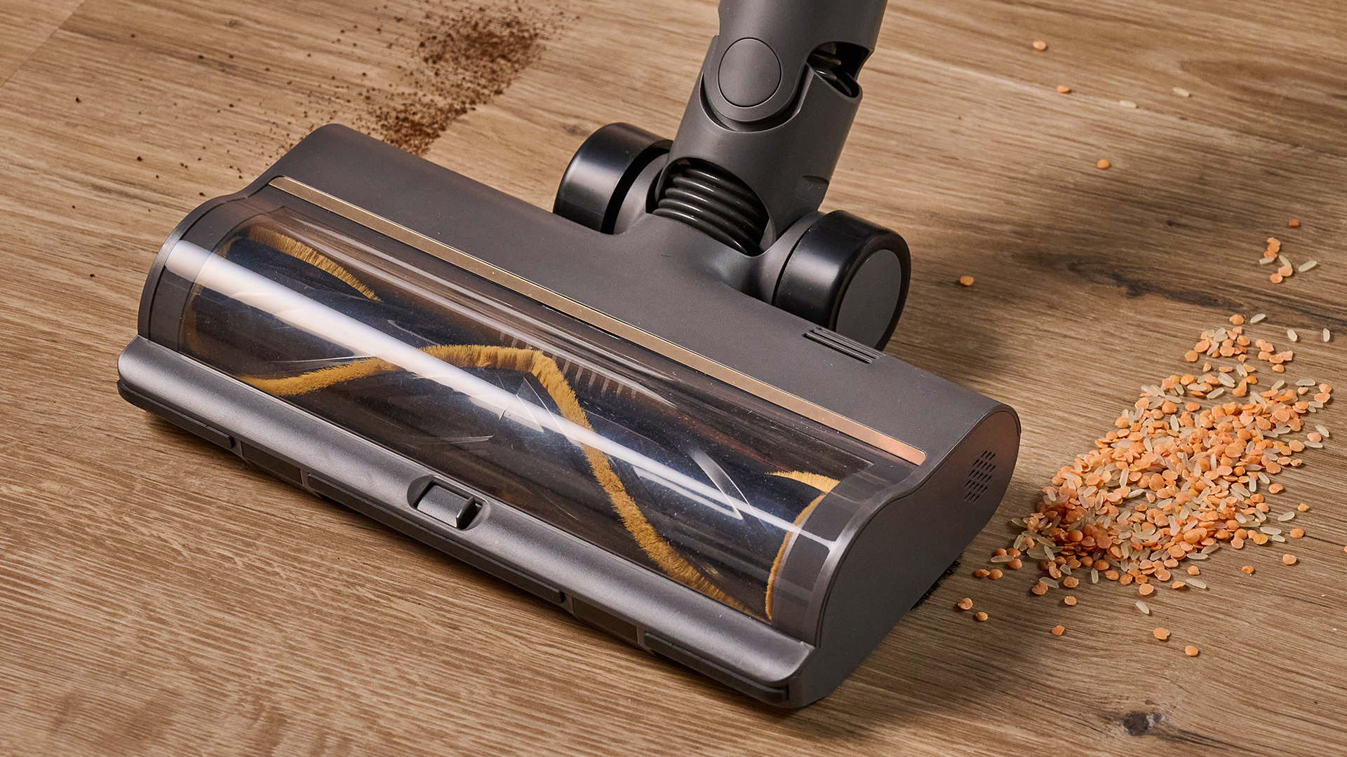 Vacuum cleaner floorhead with air intake slider, cleaning a hard floor