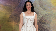 Lucy Liu wears a white lace dress