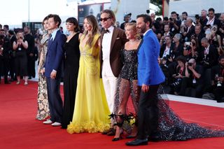 VENICE, ITALY - SEPTEMBER 05: Gemma Chan, Harry Styles, Sydney Chandler, Olivia Wilde, Chris Pine, Florence Pugh and Nick Kroll attend the "Don't Worry Darling" red carpet at the 79th Venice International Film Festival on September 05, 2022 in Venice, Italy. (Photo by Pascal Le Segretain/Getty Images)