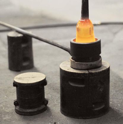 A close-up of an orange bottle. 