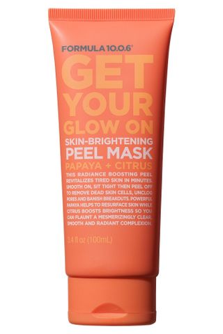 An orange tube of Formula Get Your Glow On Skin Brightening Peel Mask set against a white background.
