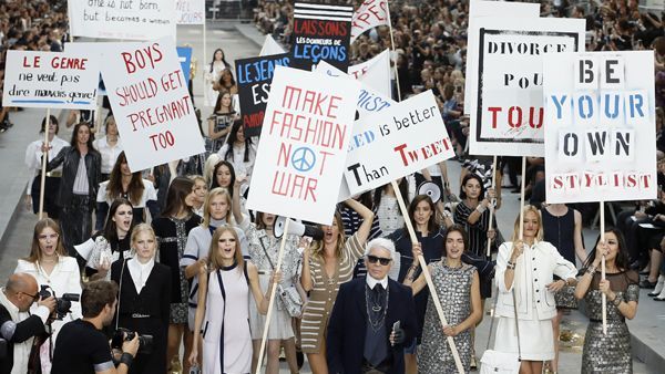 People, Protest, Dress, Street fashion, Public event, Poster, Rebellion, Handwriting, Banner, Handbag, 