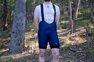 Image shows a rider wearing the Velocio Concept bib shorts which are among the best bib shorts for cycling