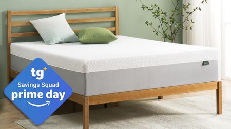 A Zinus 10-inch Green Tea Memory Foam Mattress on a bed frame in a bedroom, a Tom's Guide Savings Squad Prime Day deals badge in the bottom left.