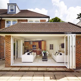 house with bifold glass door with wooden frame
