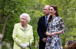 Queen Elizabeth II is shown around 'Back to Nature' by Prince William and Catherine, Duchess of Cambridge at the RHS Chelsea Flower Show 2019