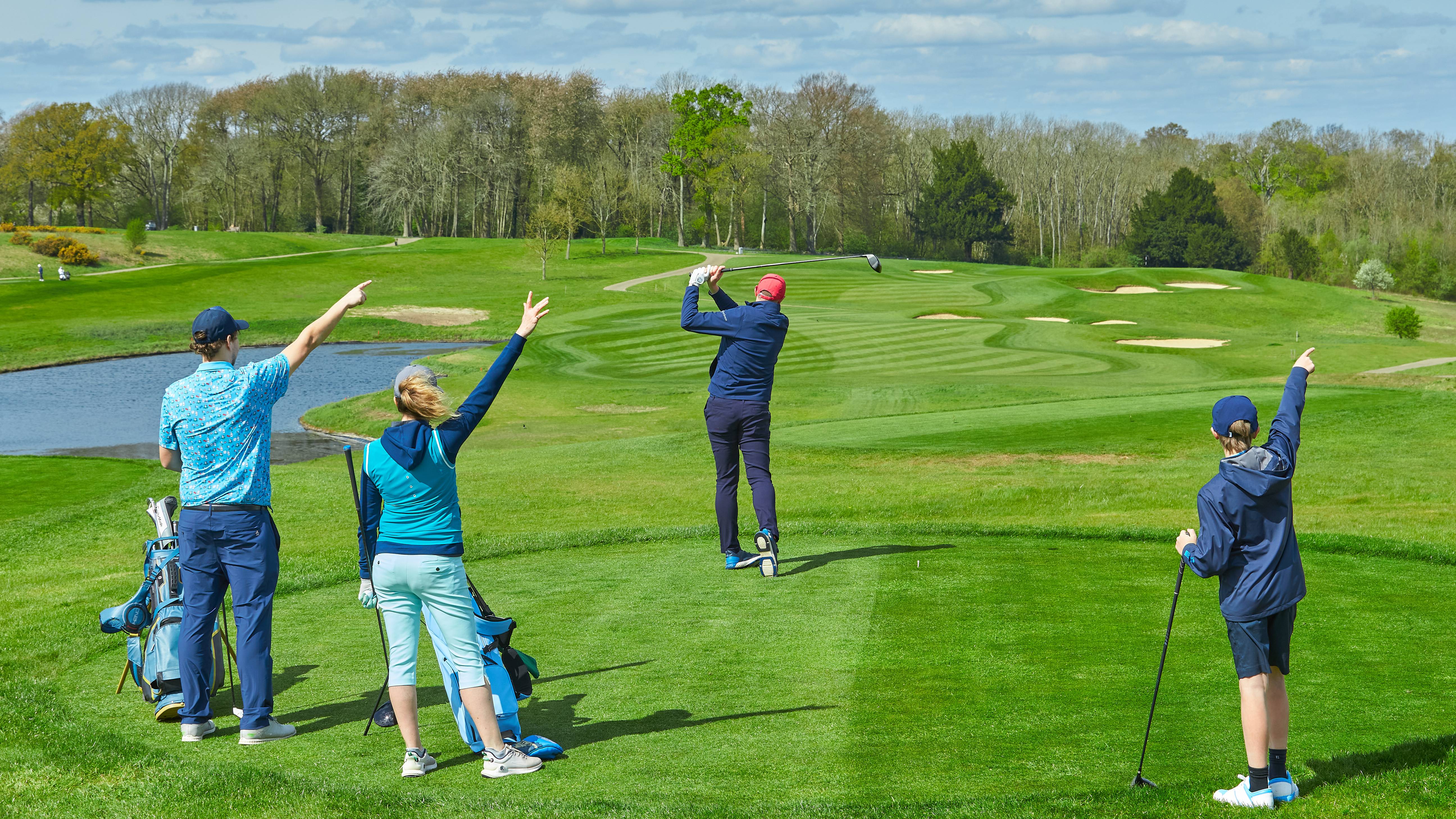 Golfer driving the ball too far right and playing partners shouting fore