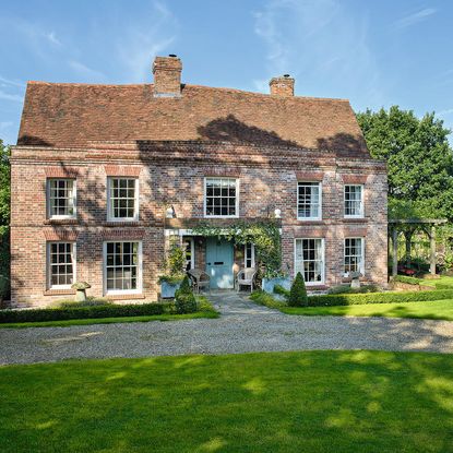 house with grass land and french window