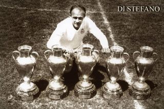 Alfredo Di Stefano poses with the five European Cups he won as a Real Madrid player.