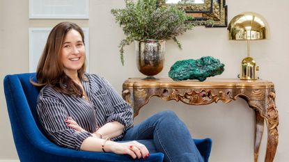 Monica Vinader in a blue armchair