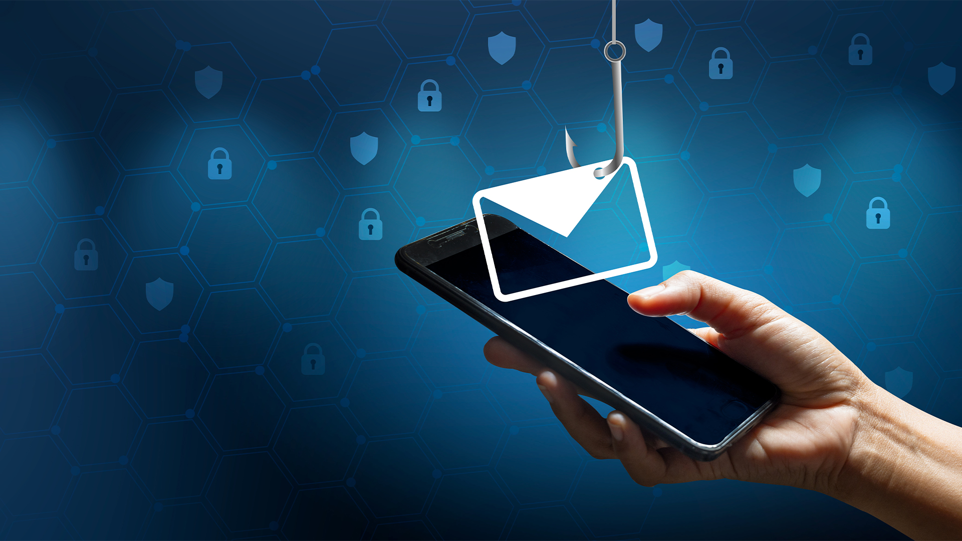 A hand holding up a phone in front of a blue grid-like background, with a fishing hook fishing an email out of the phone