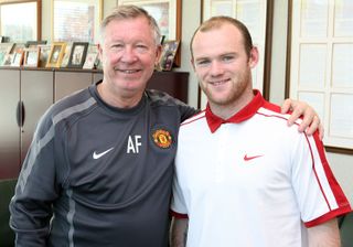 Sir Alex Ferguson and Wayne Rooney pose after the striker agreed a new contract, having previously wanted to leave the club, in October 2010.