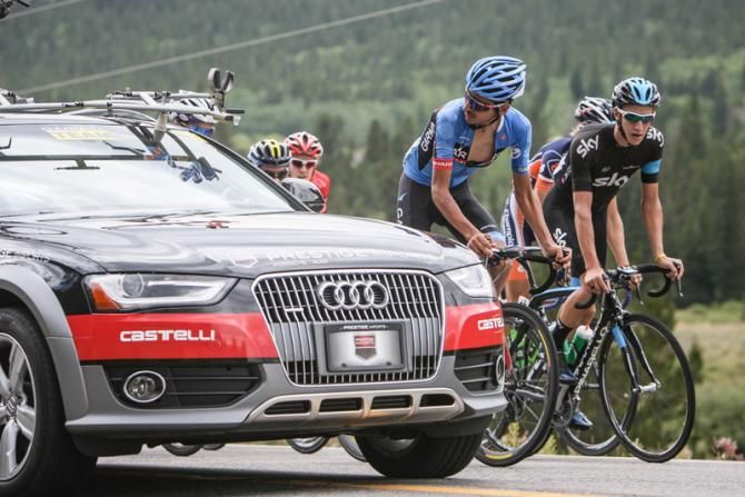 Lachlan Morton (Garmin Sharp) talks to the team car before launching his attack.