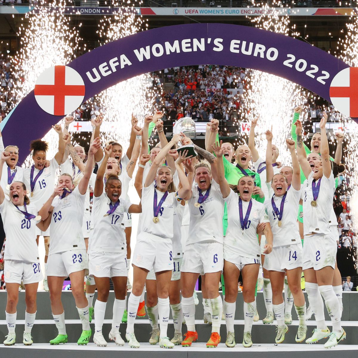History of women's football: England players celebrate winning the UEFA Women's EURO 2022 Trophy after their sides victory during the UEFA Women's Euro 2022 final match between England and Germany at Wembley Stadium on July 31, 2022 in London, England. 