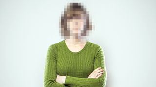 A portrait of a woman from the waist up, with arms crossed, whose face has been rendered unrecognizable by being pixelated. A conceptual representation of individual identity protection or harassment. Square crop with copy space on a clean off-white background.