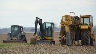Skid steer in field