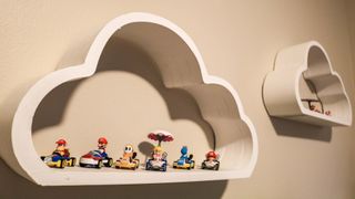 Mario Kart Hot Wheels toys displayed on floating cloud shelves