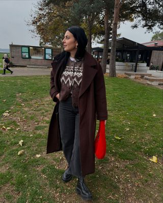 Claudia Berresford in long brown coat and fair isle cardigan