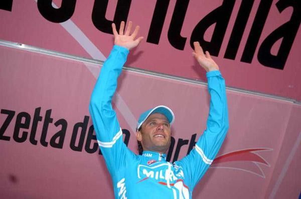 On the podium Alessandro Petacchi salutes the crowd
