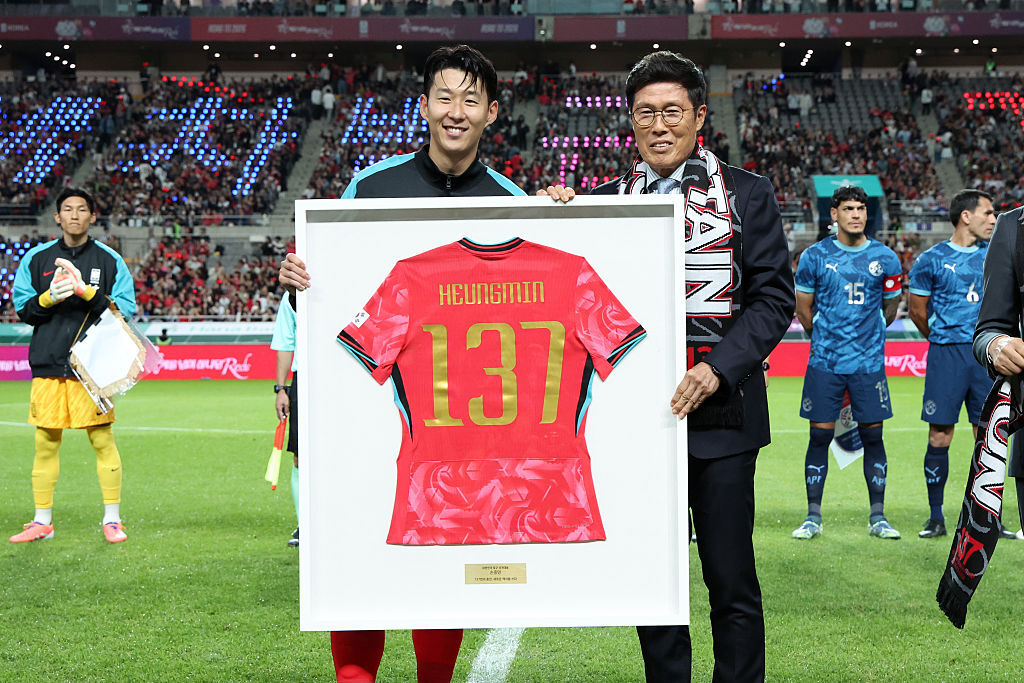Son Hueng-min is provided with a shirt to celebrate becoming the all-time leading appearance maker for the South Korean national side