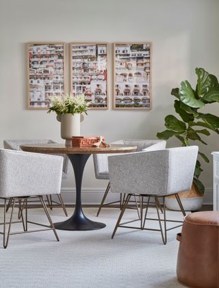 Light grey dining room with three matching framed photos in a triptych