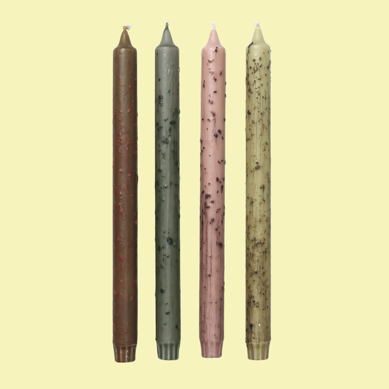 A set of four textured candles