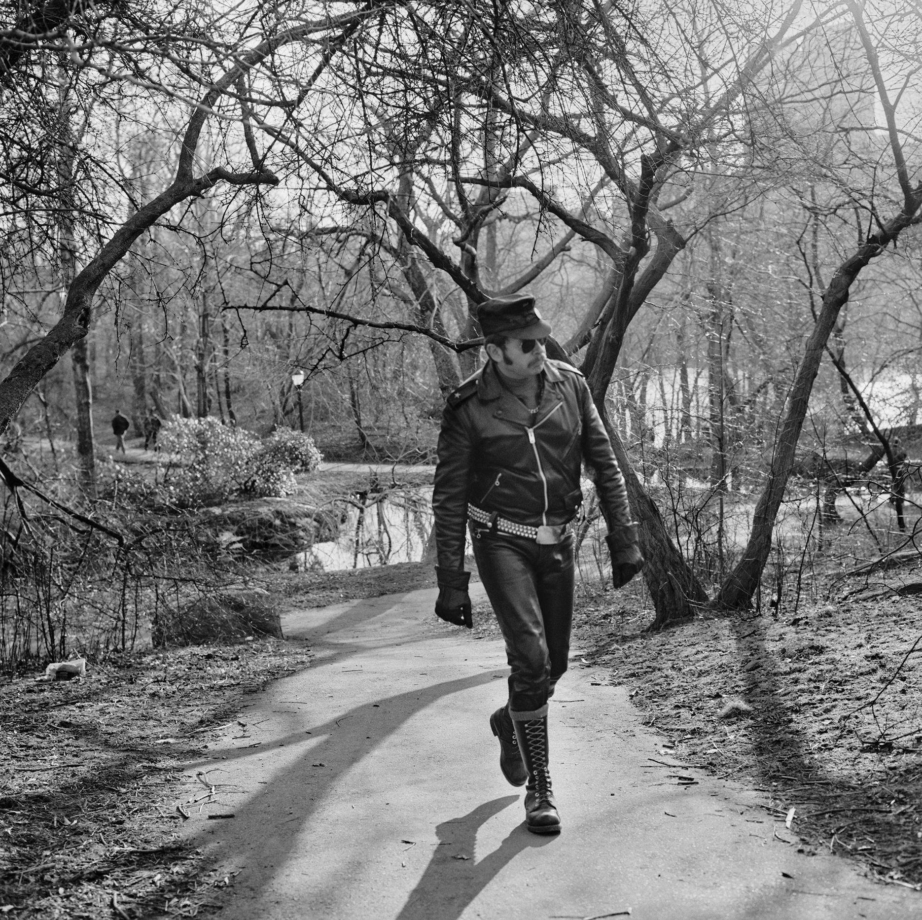 black and white photograph of man in park
