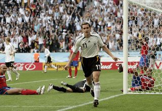 Miroslav Klose of Germany turns away in celebration after scoring his teams third goal during the FIFA World Cup Germany 2006 Group A match between Germany and Costa Rica at the Stadium Munich on June 9, 2006 in Munich, Germany.