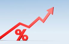 A red arrow line graph rises above a matching red percentage symbol