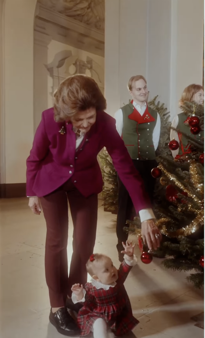 Queen Silvia helping Princess Ines decorate the tree
