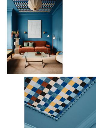 a blue living room with a rust couch and wallpaper ceiling