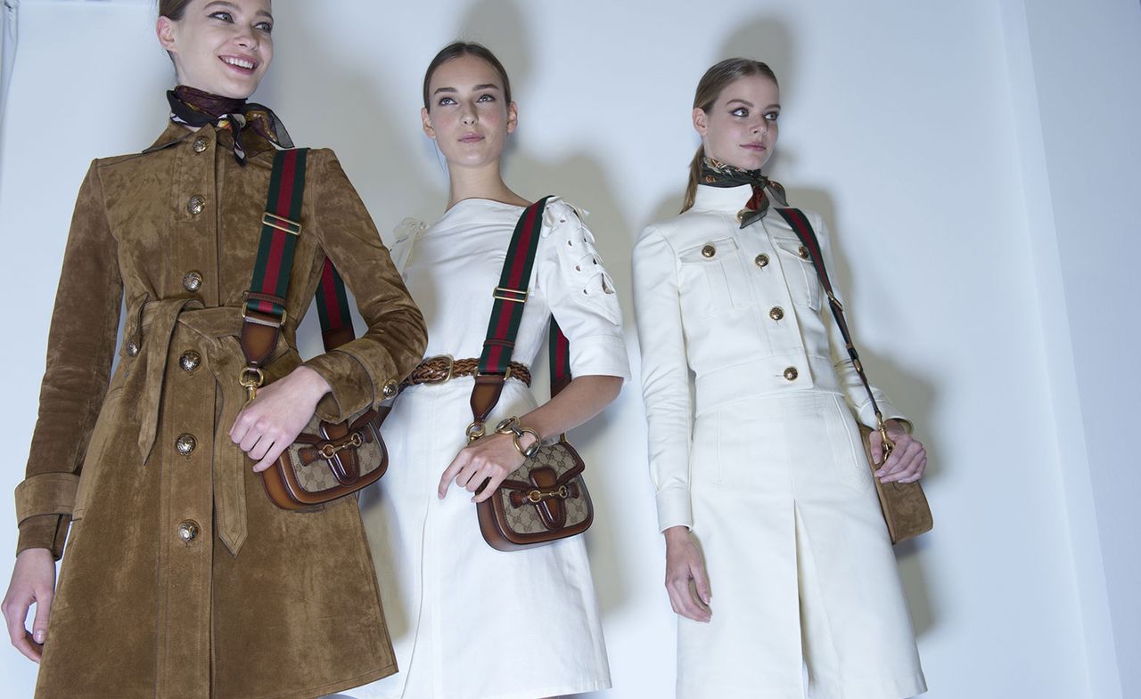 as crisp white culottes, cropped officer&#039;s jackets with shiny gold buttons and the cranberry and rust coloured suede kimono shirts