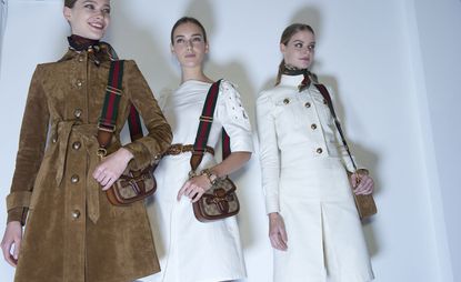 as crisp white culottes, cropped officer's jackets with shiny gold buttons and the cranberry and rust coloured suede kimono shirts