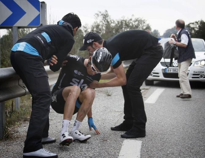 Geraint Thomas is helped up