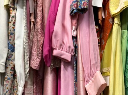 Vintage clothing in a rack.