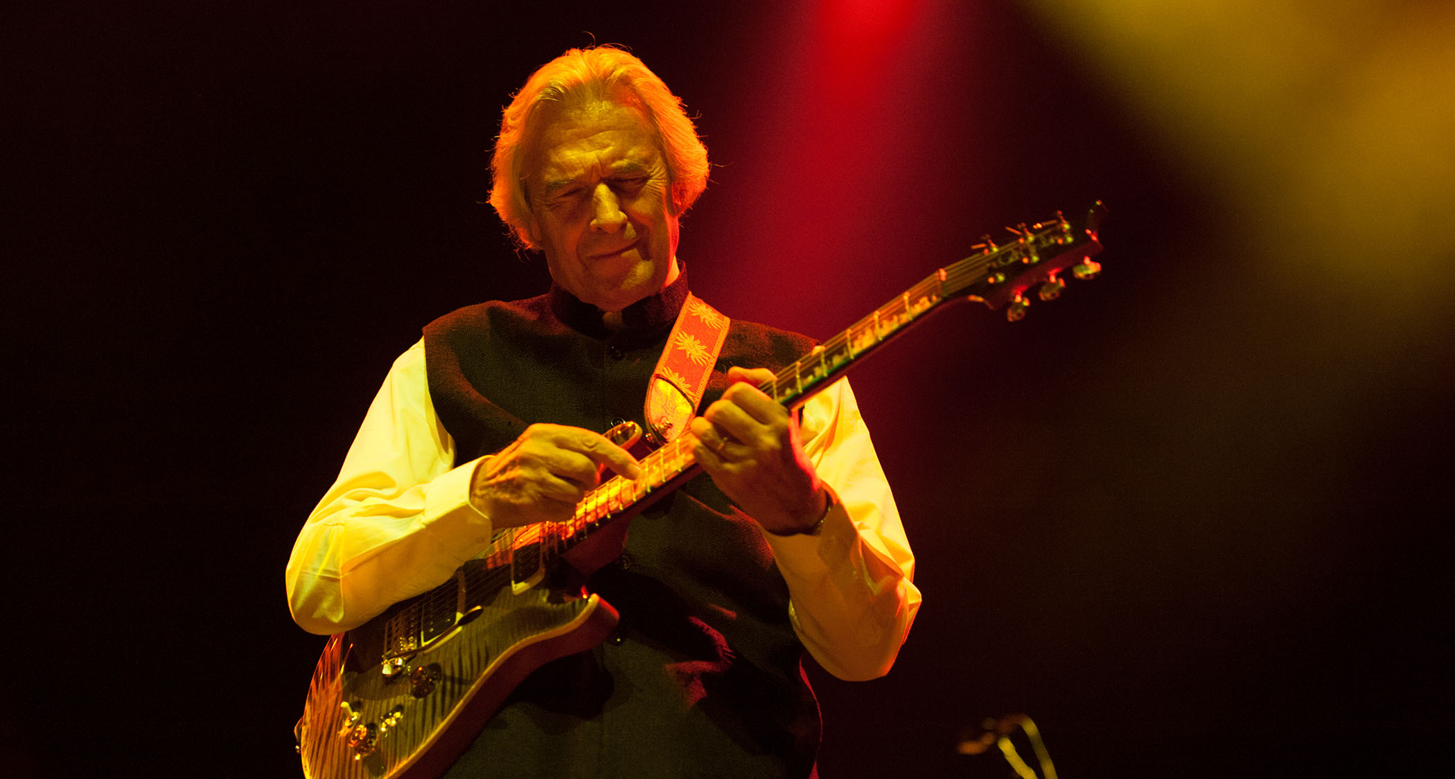 John McLaughlin taps out a melody on his PRS