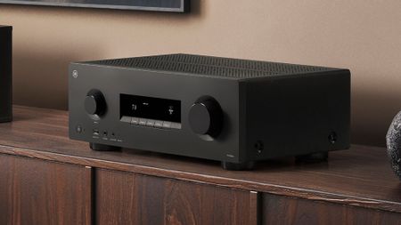 Yamaha RX300A AV receiver on top of a wooden sideboard