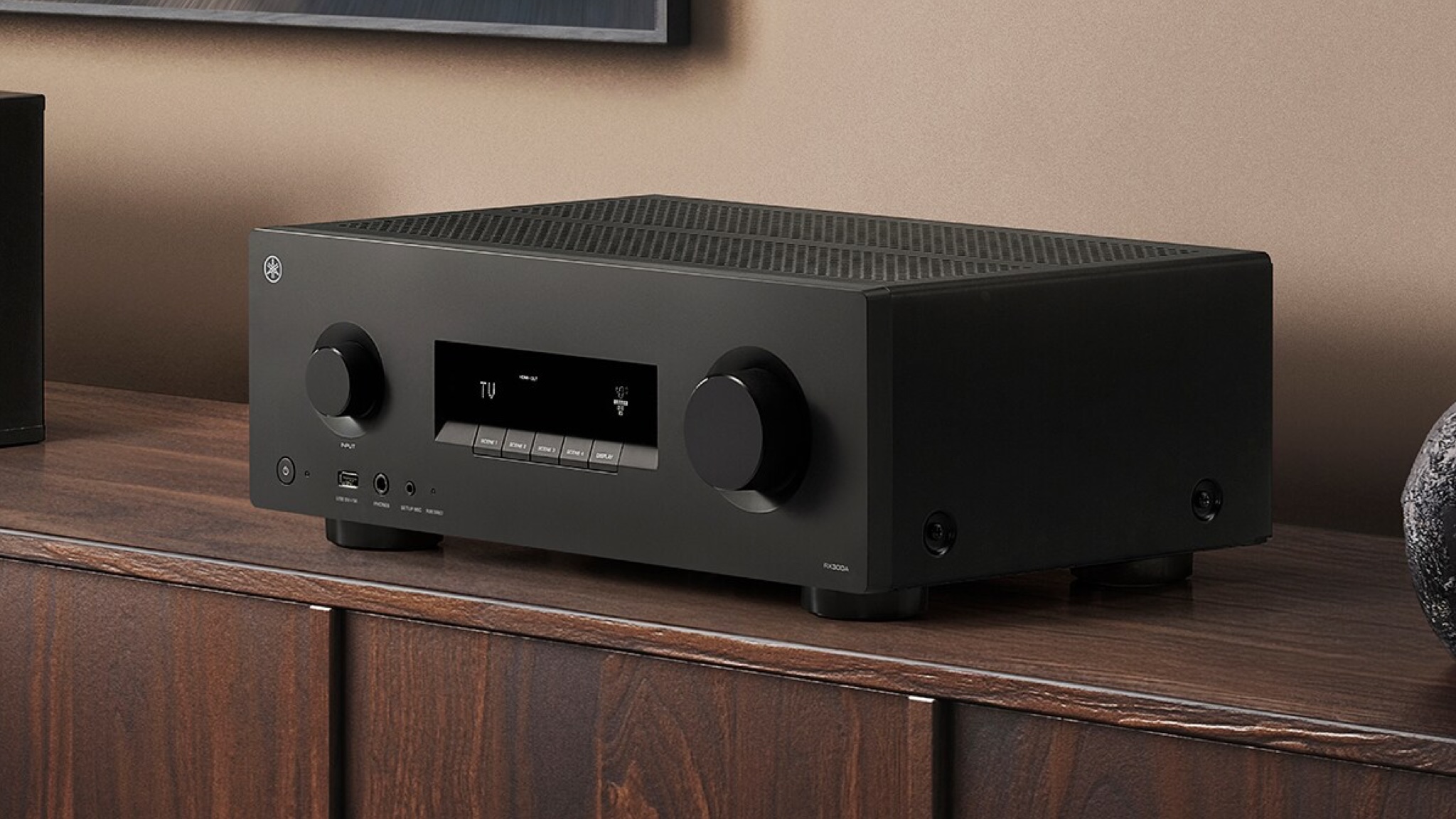 Yamaha RX300A AV receiver on top of a wooden sideboard