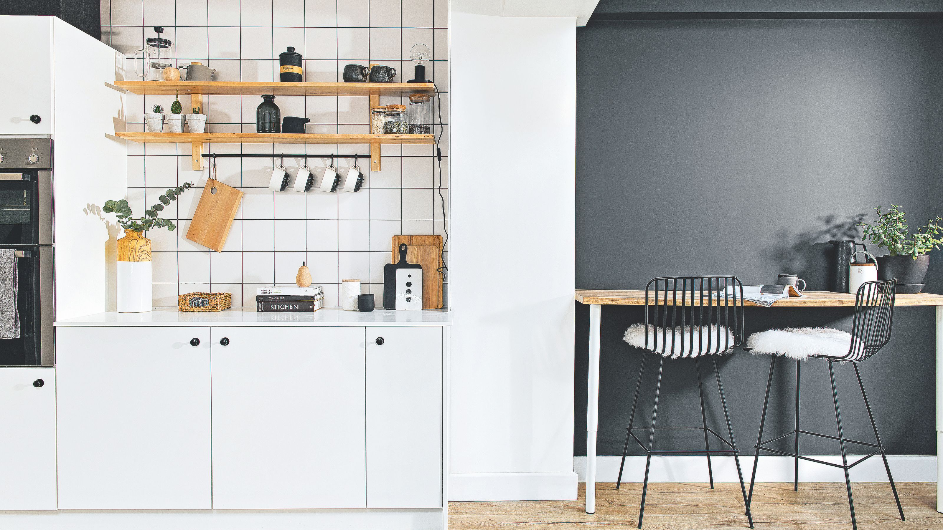 Kitchen and dining area, with paint and wall tiles used to zone the space