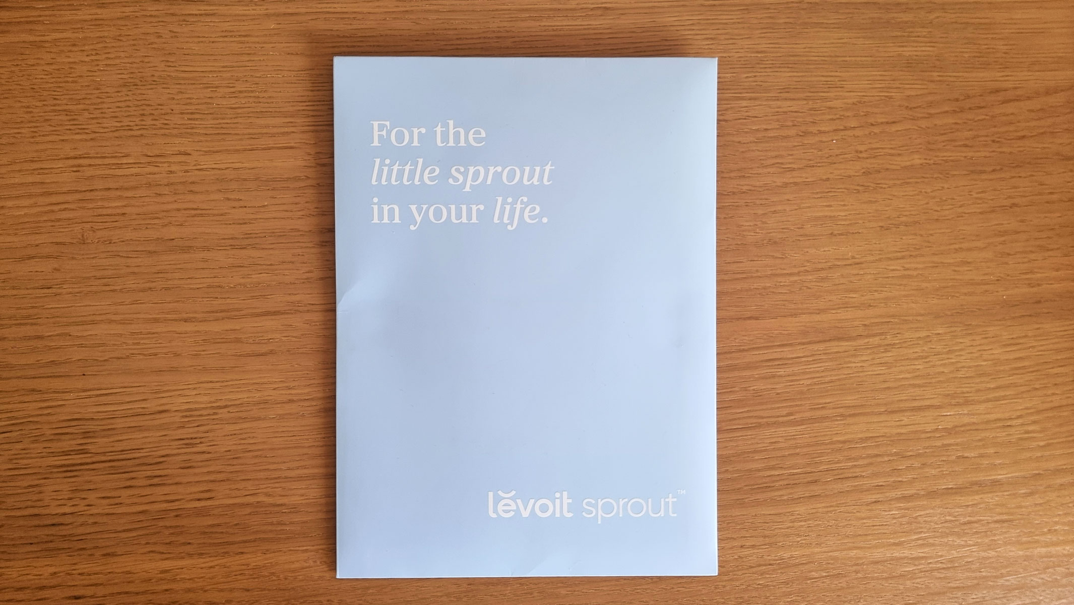 A close-up picture of the paper manual for the Levoit Sprout air purifier