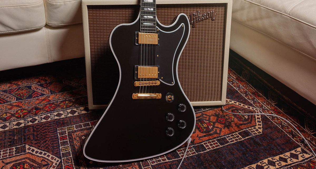 Gibson RD Custom: the cult-classic electric guitar returns in an Ebony finish, with the full Custom aesthetic of block inlays on an ebony fingerboard, multi-ply binding, and gold hardware and pickup coverings.