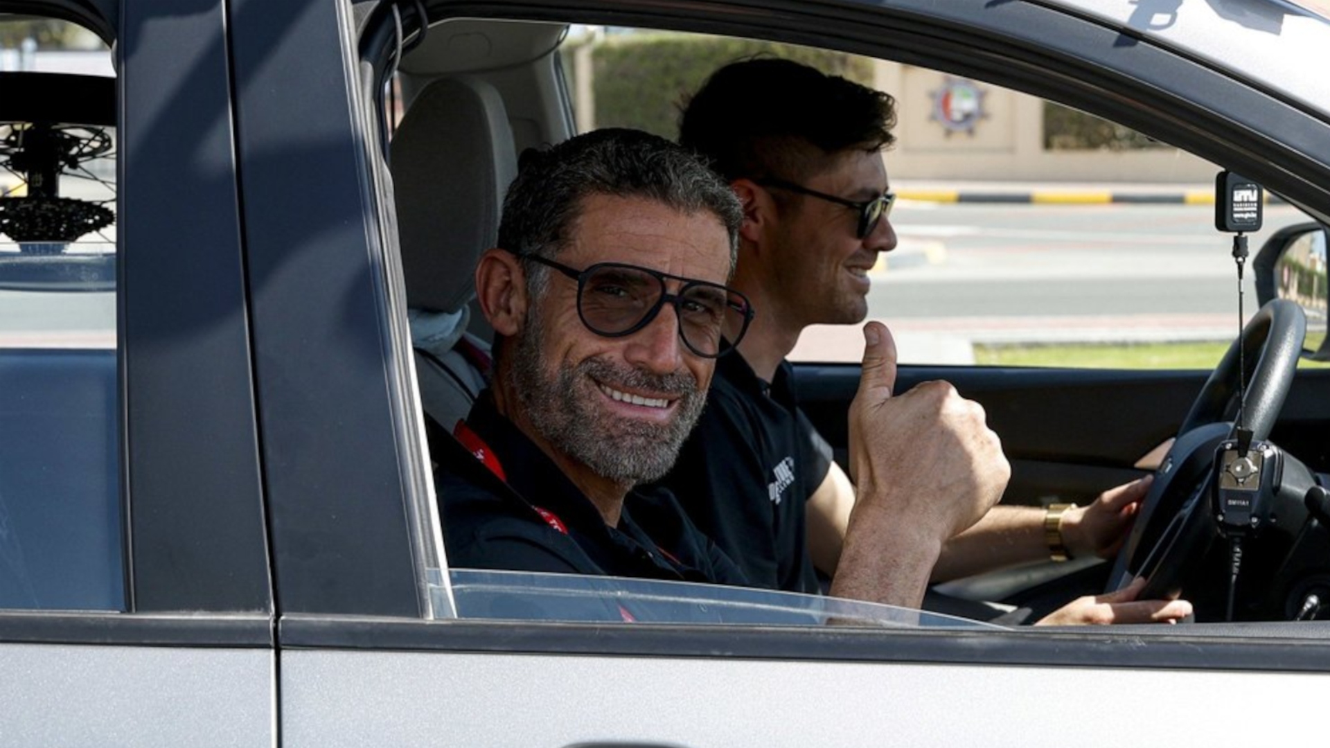George Hincapie in the Modern Adventure Pro Cycling team car with Sports Director Alex Howes