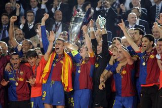 Barcelona’s Carles Puyol lifts the Champions League trophy following victory over Manchester United in 2009