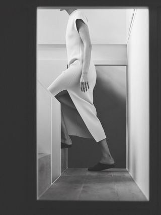 Woman in modern house wearing Fforme white dress
