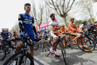 Riders observe a moment of silence before the start of stage 2 at Volta a Catalunya