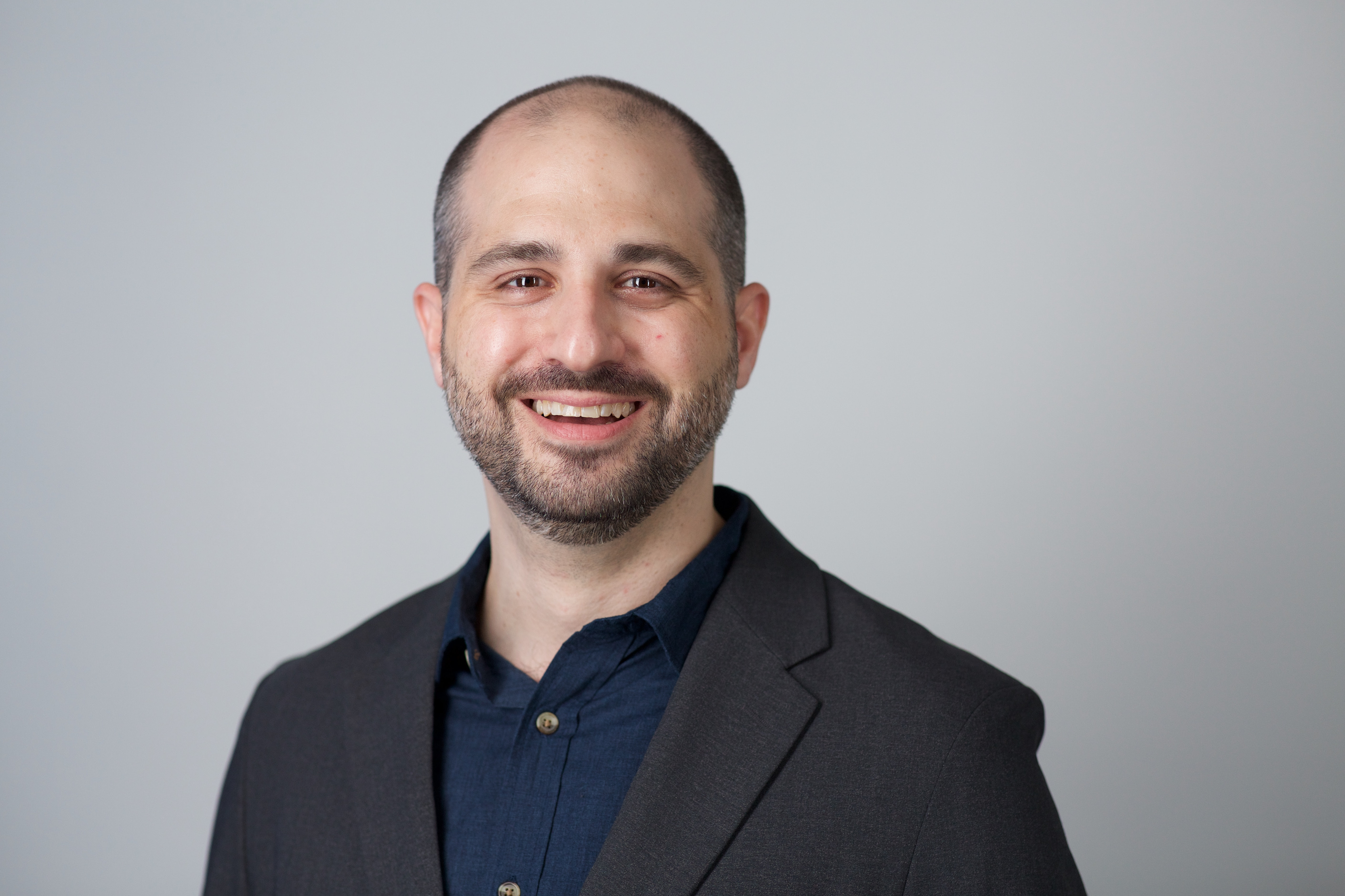 Smiling headshot of Derek Pezzotti.