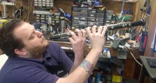 Man playing the oboe incorrectly