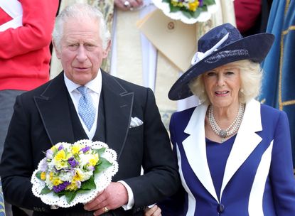 Prince Charles, Prince of Wales and Camilla, Duchess of Cornwall hold nosegays as they attend the Royal Maundy Service